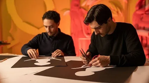 Animators creating cut out animation Animators creating cut out animation