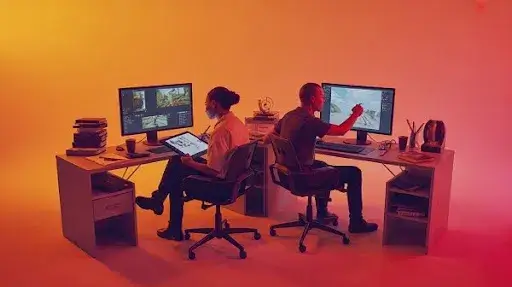 Creative professionals working on visual and gameplay elements Creative professionals working on visual and gameplay elements